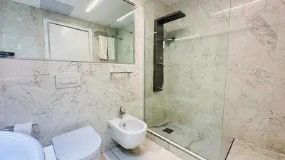 a bathroom with a toilet and a sink and a shower at Boca Beach Residence 304 in Boca Chica