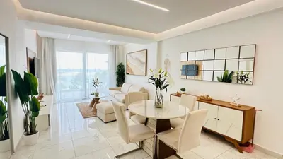 a living room with a table and chairs at Boca Beach Residence 304 in Boca Chica