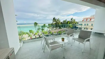 a balcony with chairs and a view of the ocean at Boca Beach Residence 304 in Boca Chica