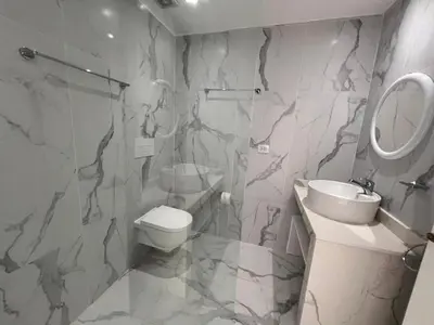 a bathroom with a shower and a toilet and a sink at Boca Beach 504, Boca Chica in Boca Chica