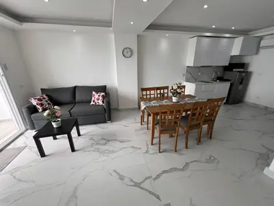 a living room with a table and a couch at Boca Beach 504, Boca Chica in Boca Chica