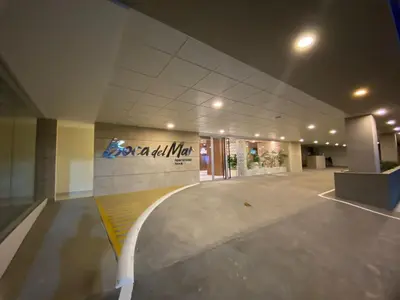 an empty lobby of a building with a sign on the wall at Residential Boca del Mar Tower III Apart 802 in Boca Chica