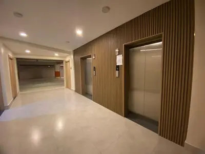 a hallway of a building with doors and a walkway at Residential Boca del Mar Tower III Apart 802 in Boca Chica