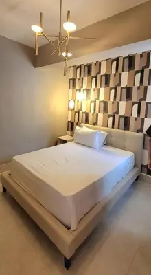 a bedroom with a large white bed in a room at Residential Boca del Mar Tower III Apart 802 in Boca Chica