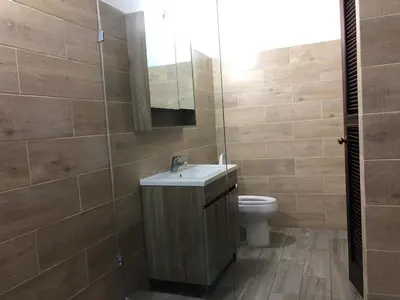 a bathroom with a sink and a toilet at Villa twin palm in Sosúa