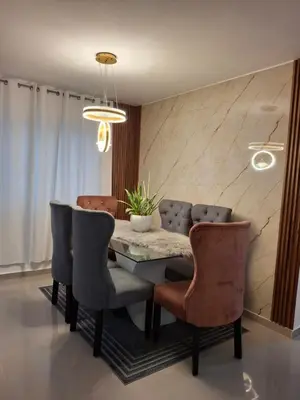 a dining room with a table and chairs at Luna airport retreat in Boca Chica