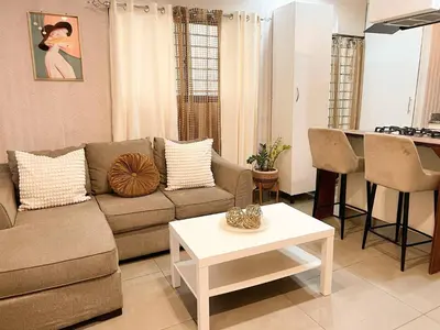a living room with a couch and a table at Colonial leyton apartment in Santo Domingo