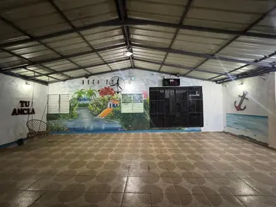 a large room with a painting on the wall at Villa club turístico tu ancla in Los Alcarrizos