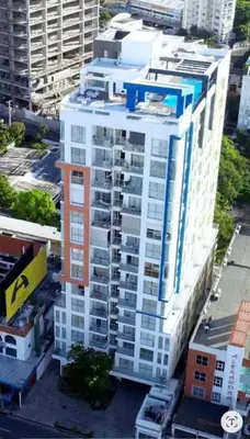 an aerial view of a tall white building at Lujoso apartamento en Piantini in Santo Domingo