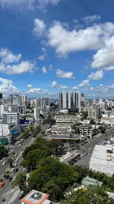a view of a city with cars and buildings at Lujoso apartamento en Piantini in Santo Domingo