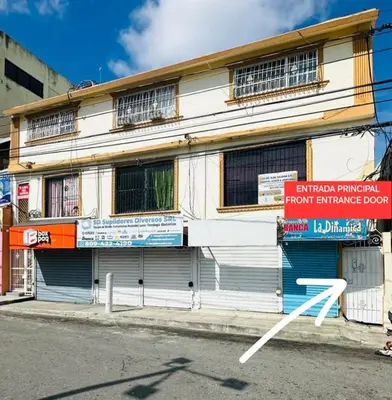 a building on the side of a street at Apartamento cerca de todo en SDE in Santo Domingo