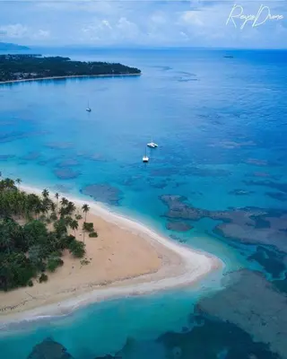 an aerial view of a beach with a boat in the water at Modern apartament near the sea-Las Terrenas in Las Terrenas