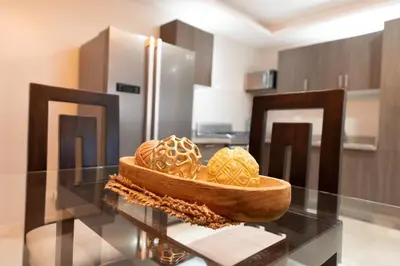 a bowl of eggs on a glass table in a kitchen at City Center, 2-BR Suite close to Shops, Restaurants, Bars and More in Santo Domingo