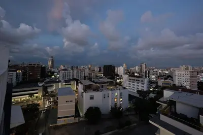 a view of a city at night with buildings at City Center, 2-BR Suite close to Shops, Restaurants, Bars and More in Santo Domingo