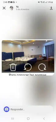a picture of a bedroom with a bed and a table at Atardecer Albatros in Juan Dolio