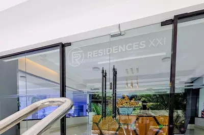 a glass facade of a restaurant with a sign that reads reserves xix at Cozy 1BR Condo, Pool, Gym in Santo Domingo