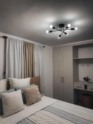 a bedroom with a bed and a ceiling fan at Amor in Punta Cana
