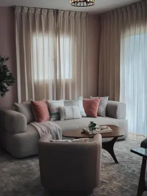a living room with a couch and a table at Amor in Punta Cana