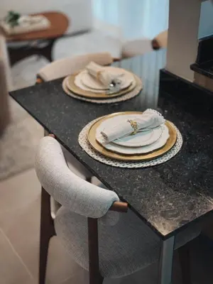 a table with plates and napkins on top of it at Amor in Punta Cana