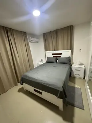 a bedroom with a large bed in a room at Apartamento deluxes en Bonao in Bonao