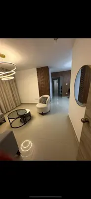 a living room with a couch and a table at Apartamento deluxes en Bonao in Bonao