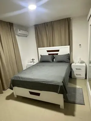 a bedroom with a large bed in a room at Apartamento deluxes en Bonao in Bonao