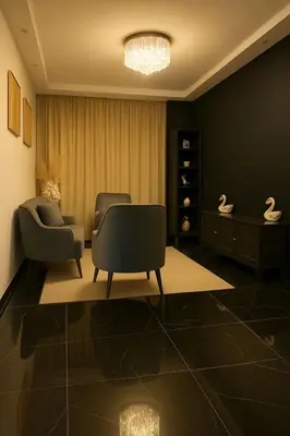 a living room with two chairs and a chandelier at Comfortable and Attractive Apartment in Ensanche Savica de Mendoza