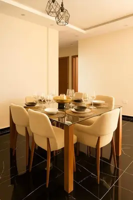 a dining room with a wooden table and chairs at Comfortable and Attractive Apartment in Ensanche Savica de Mendoza
