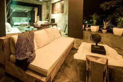 a living room with a couch and a table at House Cottage in Caribbean Mountains 2