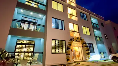 a building with many windows and lights on it at Zarzuela Villas del Mar Puerto Plata in Muñoz