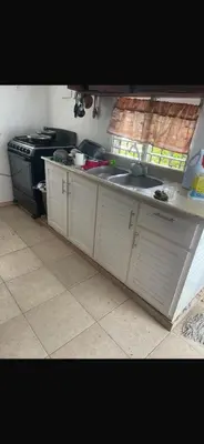 a kitchen with a sink and a stove at santo domingo airport villa in Reparto Esther Rosario