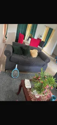 a living room with a couch and a table at santo domingo airport villa in Reparto Esther Rosario