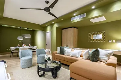 a living room with two couches and a table at Elegant and Cozy 1BD Condo in Santo Domingo
