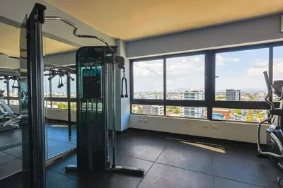 a gym with a view of a city at Elegant and Cozy 1BD Condo in Santo Domingo