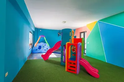 a play room with a slide and a playground at Elegant and Cozy 1BD Condo in Santo Domingo