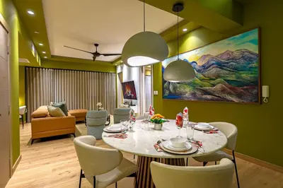 a dining room with a table and chairs at Elegant and Cozy 1BD Condo in Santo Domingo