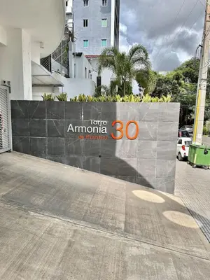 a sign on a wall on a street at Chic Elegant City Center Condo in Santo Domingo