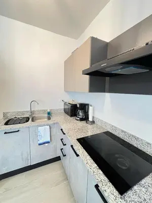 a kitchen with a sink and a counter top at apartamento exclusivo con jacuzzi, piscina y vista al lago in Las Terrenas