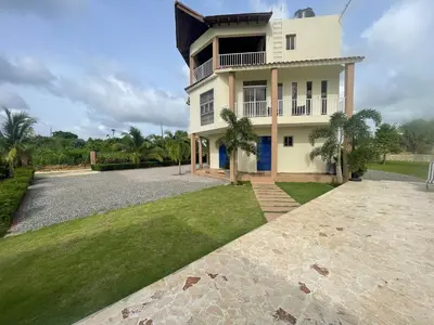 a large white house with a large driveway at Jeda Village in Higuey