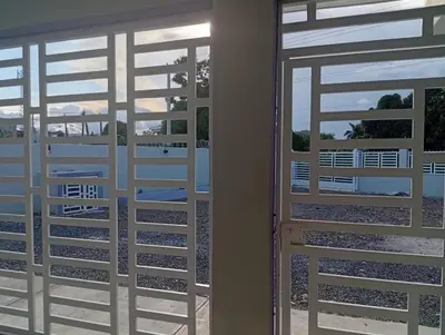 a pair of doors with a view of a patio at Villa colombia in Miches