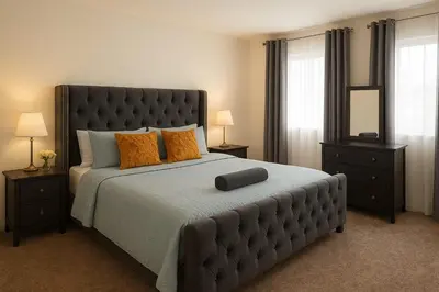 a bedroom with a large bed with orange pillows at Bright & Spacious En-suite Room - Santo Domingo Este in Cancino