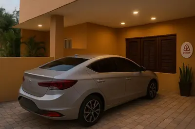 a white car parked in front of a house at Bright & Spacious En-suite Room - Santo Domingo Este in Cancino