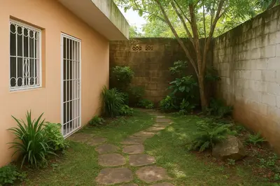 a walkway in front of a house with a tree at Bright & Spacious En-suite Room - Santo Domingo Este in Cancino
