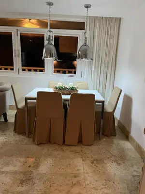 a dining room with a table and chairs at Antiguo Dominican Bay in Cuevas