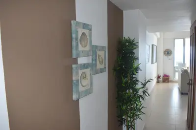 a hallway with art on the wall at El Sueño, Breathtaking Ocean Front, Juan Dolio in Guayacanes