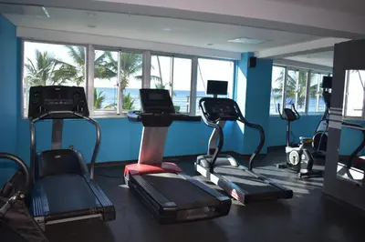 a gym with treadmills and exercise bikes in a room at El Sueño, Breathtaking Ocean Front, Juan Dolio in Guayacanes