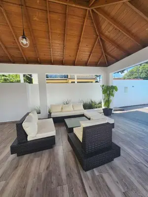 a living room with two couches and a table at Cerro hermoso in Santiago de los Caballeros