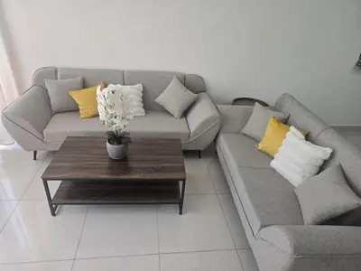 a living room with a couch and a coffee table at Sunset Apartment Beach Residences Steps from the Beach in Puerto Plata