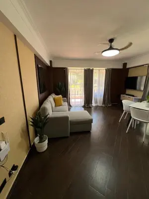 a living room with a couch and a table at Brisa de Mar in Boca Chica
