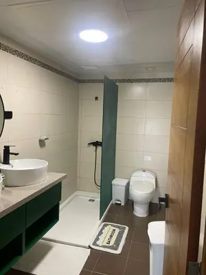 a bathroom with a toilet and a sink at Luxury Penthhouse Frente Al Mar in Juan Dolio